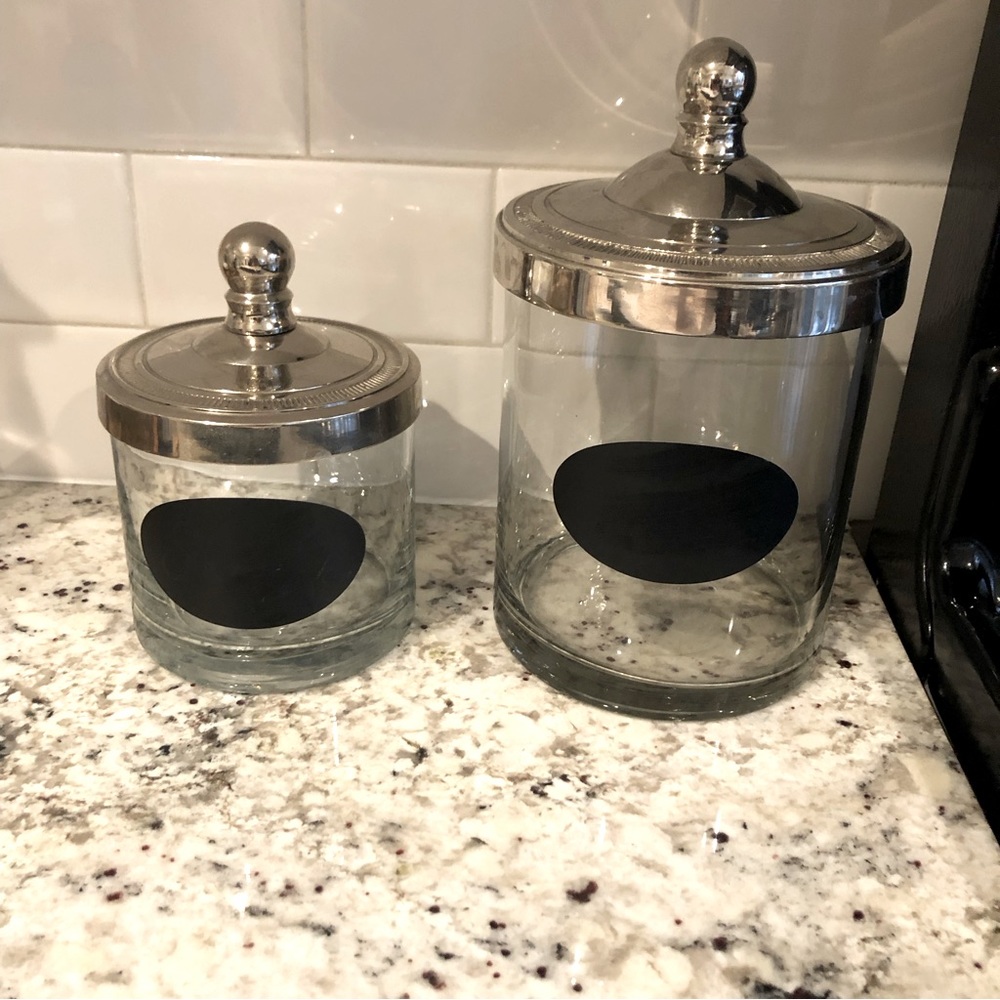 Pottery Barn glass storage jars with sterling silver lids.